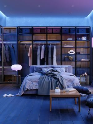 A blue bedroom with mood lighting.