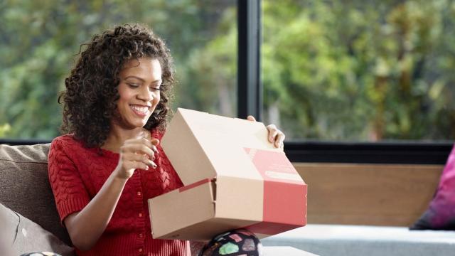 woman opening australia post package