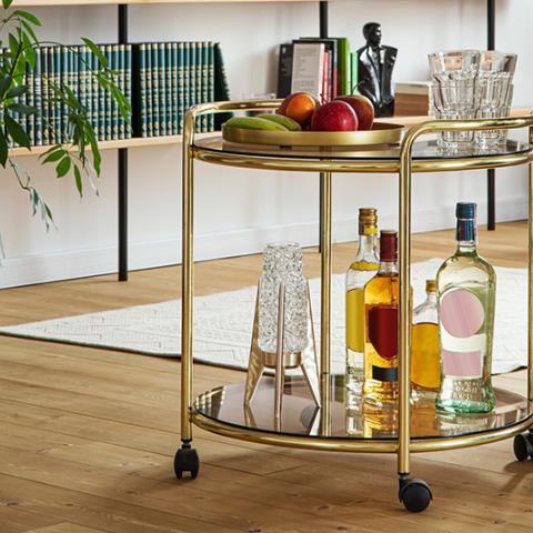 Gold bar cart with drinks